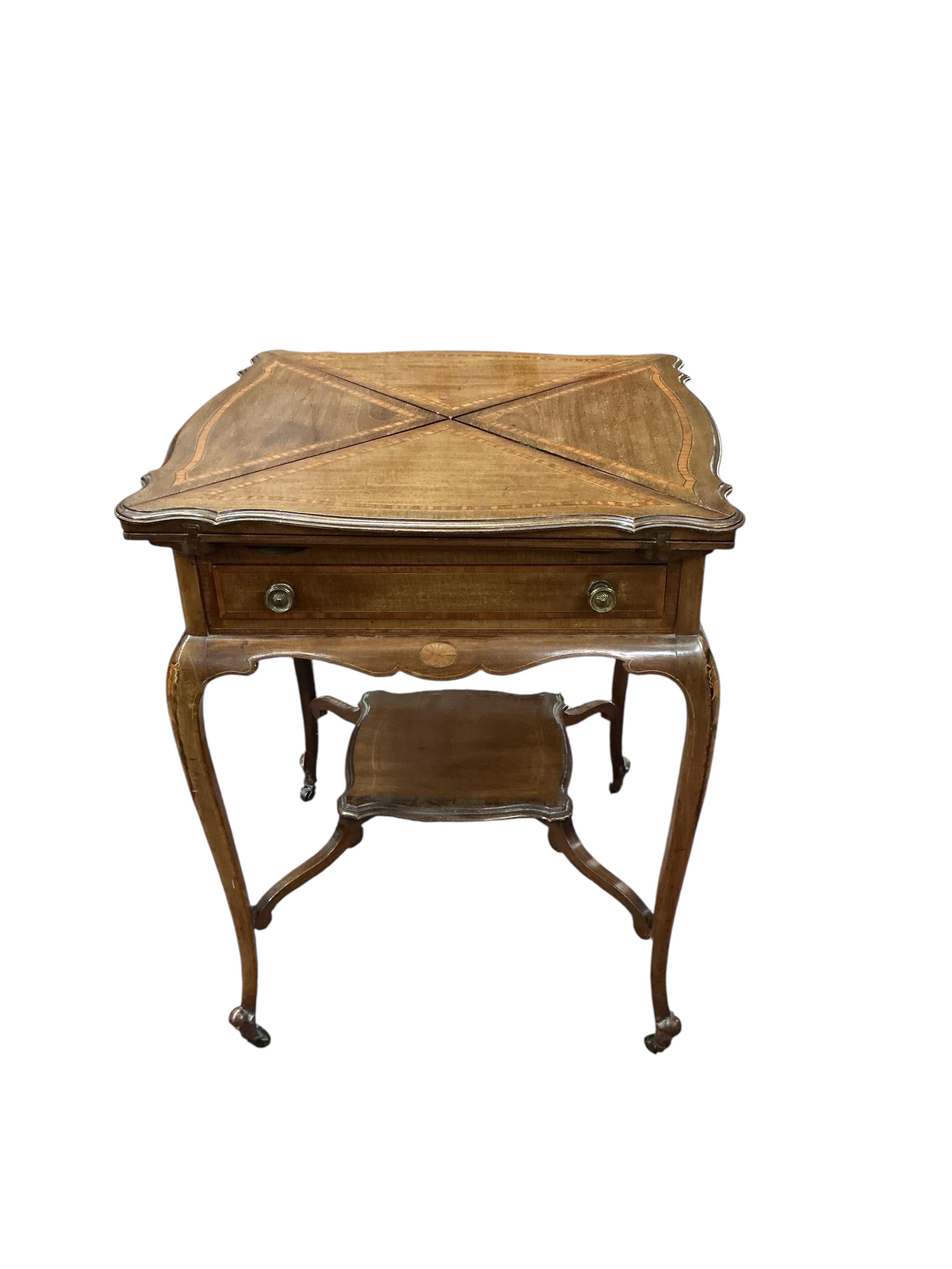An Edwardian satinwood banded mahogany envelope card table, width 57cm, depth 57cm, height 74cm